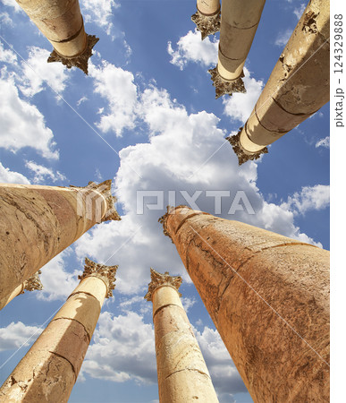 Roman Columns in the Jordanian city of Jerash (Gerasa of Antiquity), capital and largest city of Jerash Governorate, Jordan. Against the background of a beautiful sky with clouds Roman Columns in the Jordanian city of Jerash (Gerasa of Antiquity), capital and largest city of Jerash Governorate, Jordan. Against the background of a beautiful sky with clouds 124329888