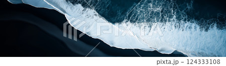 Breathtaking aerial view of powerful ocean waves crashing on black sand beach in iceland 124333108