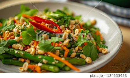 Fresh thai salad with asparagus, herbs, carrots, peanuts, and chili pepper 124333428