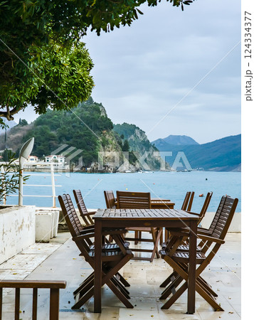 A Tranquil Café Table Surrounded by Nature, Perfect for Rest and Relaxation A Tranquil Café Table Surrounded by Nature, Perfect for Rest and Relaxation 124334377