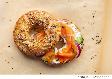 Lox bagel. A sandwich with smoked salmon and fresh vegetables Lox bagel. A sandwich with smoked salmon and fresh vegetables 124334567