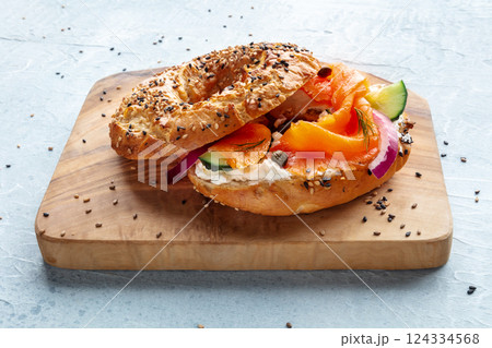 Lox bagel. A sandwich with smoked salmon and fresh vegetables Lox bagel. A sandwich with smoked salmon and fresh vegetables 124334568