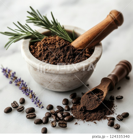 Aromatic coffee grounds in mortar with lavender and rosemary on marble surface 124335340
