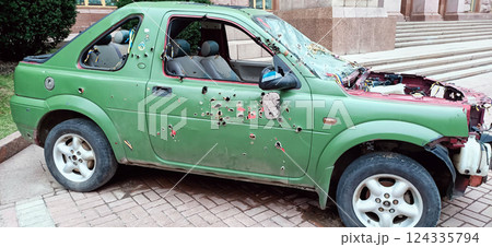 Kyiv, Ukraine March 15, 2024: A car with traces of bullets and shrapnel on display in the center of Kyiv for inspection by citizens 124335794