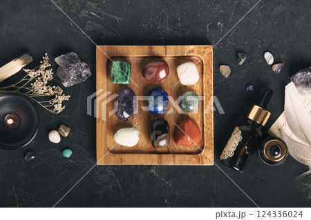 Healing Crystals and Aromatherapy Display on Wooden Tray 124336024