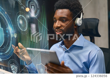 Professional Consultant Using Digital Tablet With Virtual Screen and Data Analysis Tools 124336056