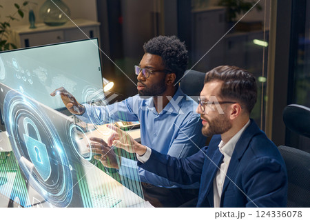 Innovative Team Collaborating on Cybersecurity Solutions with Futuristic Digital Interface 124336078
