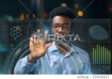 Man Interacting With Futuristic Interface Display Featuring Graphs And Technology Concept Elements 124336227