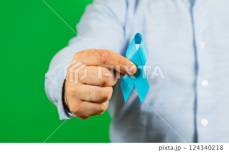 Raising awareness for male health issues with a blue ribbon Raising awareness for male health issues with a blue ribbon 124340218