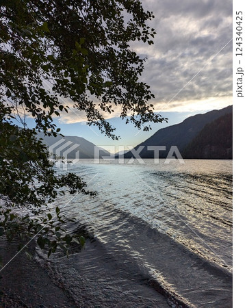 Tranquil Lake Crescent with Reflective Waters and Scenic Mountain Views Tranquil Lake Crescent with Reflective Waters and Scenic Mountain Views 124340425