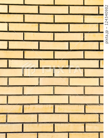 Yellow brick wall background texture background. Modern brickwork background 124340982