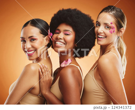 Beauty, makeup and diversity with women and flowers petals on face for wellness, natural and cosmetics. Skincare, luxury and model with girls for spa facial, spring and salon with plant product 124341372