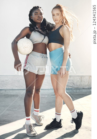 Fitness, soccer and portrait of woman athletes standing with a ball in the city for sports training. Football, workout and healthy interracial girl friends in a urban town for exercise or sport match Fitness, soccer and portrait of woman athletes standing with a ball in the city for sports training. Football, workout and healthy interracial girl friends in a urban town for exercise or sport match 124341565