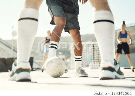 Football, ball and team of fitness people play a game, training and challenge together in the city. Soccer, workout and sports people play, workout or exercise for health and wellness in urban town 124341566
