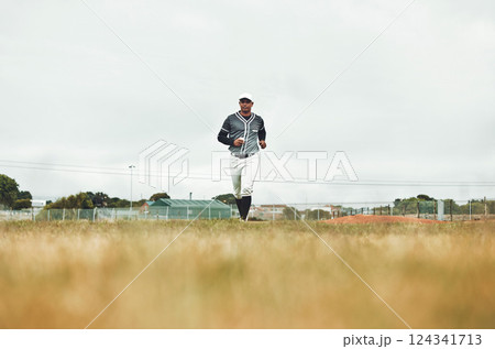 Baseball player running on a baseball field for training, sport and fitness in physical, competitive game. Sports, health and baseball with a man athlete at the start of a match on a field outdoors Baseball player running on a baseball field for training, sport and fitness in physical, competitive game. Sports, health and baseball with a man athlete at the start of a match on a field outdoors 124341713