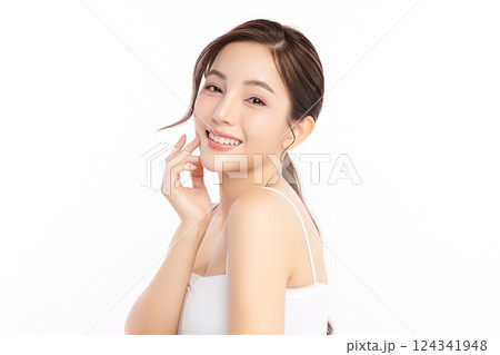 A beautiful young Asian woman with clean, fresh skin against a white background. Skincare, facial treatment, cosmetology, beauty, and spa. An elegant portrait of an Asian woman. A beautiful young Asian woman with clean, fresh skin against a white background. Skincare, facial treatment, cosmetology, beauty, and spa. An elegant portrait of an Asian woman. 124341948