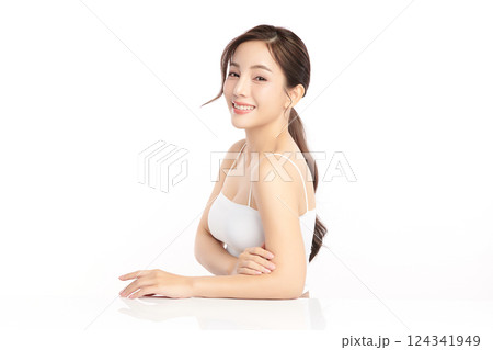 A beautiful young Asian woman with clean, fresh skin against a white background. Skincare, facial treatment, cosmetology, beauty, and spa. An elegant portrait of an Asian woman. A beautiful young Asian woman with clean, fresh skin against a white background. Skincare, facial treatment, cosmetology, beauty, and spa. An elegant portrait of an Asian woman. 124341949