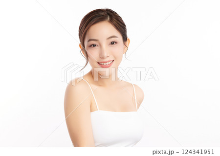 A beautiful young Asian woman with clean, fresh skin against a white background. Skincare, facial treatment, cosmetology, beauty, and spa. An elegant portrait of an Asian woman. A beautiful young Asian woman with clean, fresh skin against a white background. Skincare, facial treatment, cosmetology, beauty, and spa. An elegant portrait of an Asian woman. 124341951