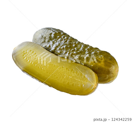whole and halved pickled cucumber isolated on a white background. whole and halved pickled cucumber isolated on a white background. 124342259