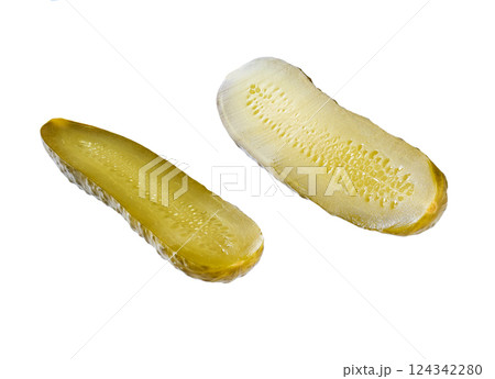 a pickled cucumber cut in half isolated on a white background. a pickled cucumber cut in half isolated on a white background. 124342280
