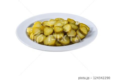 chopped pickled cucumbers in a white plate isolated on a white background. chopped pickled cucumbers in a white plate isolated on a white background. 124342290