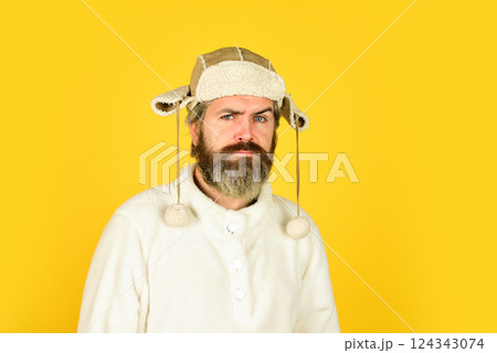 Winter warmness. Portrait of brutal man in fleece sweatshirt. Handsome male model wearing warm hat. casual man in winter hat and warm clothes. serious hipster wear warm hat. cold and flu Winter warmness. Portrait of brutal man in fleece sweatshirt. Handsome male model wearing warm hat. casual man in winter hat and warm clothes. serious hipster wear warm hat. cold and flu 124343074