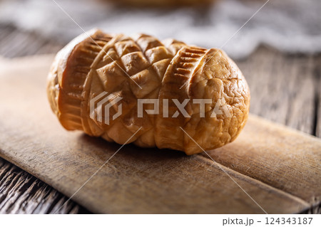 Oscypki - Traditional salty smoked cheese made from sheep's milk from the Polish region of Zakopane under the High Tatras Oscypki - Traditional salty smoked cheese made from sheep's milk from the Polish region of Zakopane under the High Tatras 124343187