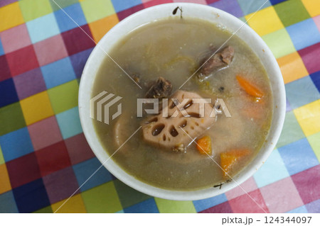 close up of Cantonese homemade cooked Green Radish Carrot pork soup in a white bowl close up of Cantonese homemade cooked Green Radish Carrot pork soup in a white bowl 124344097