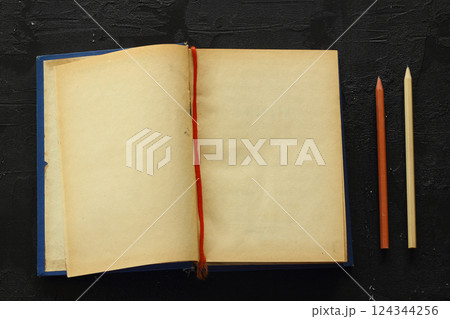 Blank opened advertising folder isolated on black background Blank opened advertising folder isolated on black background 124344256