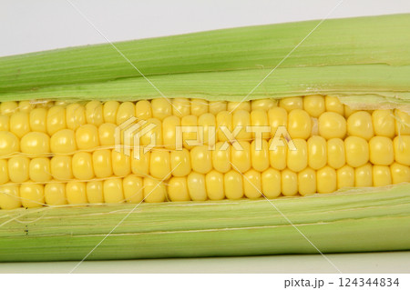 Raw corn on a white the background 124344834