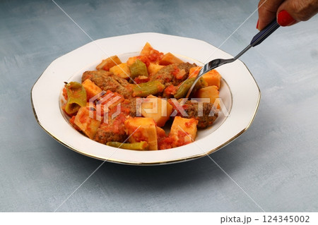 Traditional Homemade Turkish Food Kofte - Kofta with Tomato Sauce and Potatoes. (Turkish name; Izmir kofte) 124345002