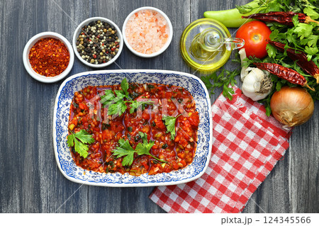 A spicy Turkish appetizer "Acili ezme" made with tomatoes, pepper, parsley, mint, olive oil 124345566