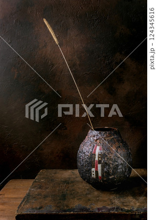 Dried Grass Stem in Ceramic Vase Dried Grass Stem in Ceramic Vase 124345616