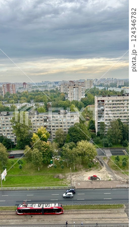 A summer view of an area of the city with lots of grass and trees A summer view of an area of the city with lots of grass and trees 124346782