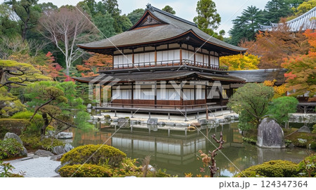 Elegant japanese gazebo surrounded by lush garden, showcasing architectural beauty in gentle light 124347364