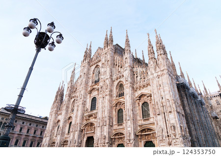 Duomo cathedral in Milan, Italy with intricate gothic architecture Duomo cathedral in Milan, Italy with intricate gothic architecture 124353750