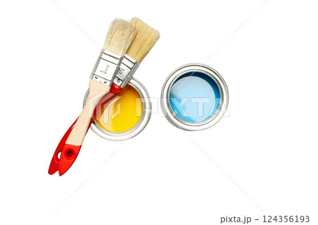 Two cans with yellow and blue paint and brushes, isolated on white, PNG 124356193