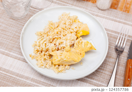 Steamed chicken breast with basmati rice for dinner 124357786