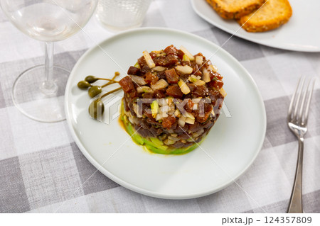 Tuna tartare appetizer served on platter 124357809