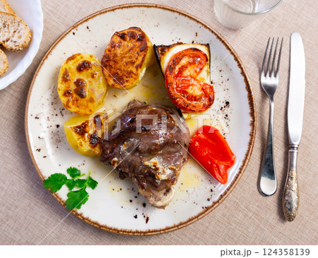 Traditional Spanish grilled pork cheeks with vegetables Traditional Spanish grilled pork cheeks with vegetables 124358139