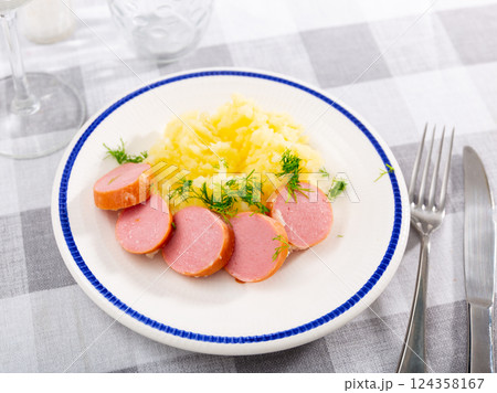 Common European breakfast is boiled sausages garnished with mashed potatoes Common European breakfast is boiled sausages garnished with mashed potatoes 124358167