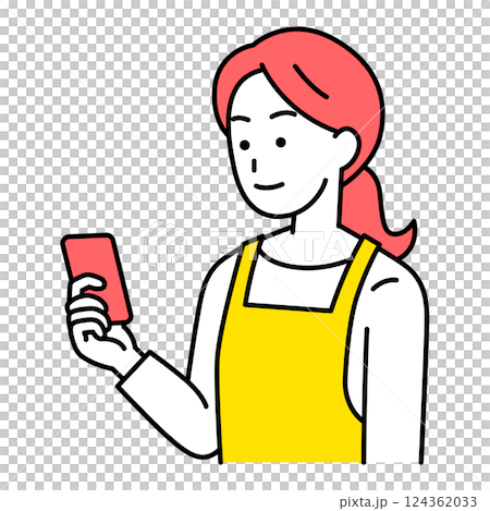 A woman in an apron looking at a smartphone screen A woman in an apron looking at a smartphone screen 124362033