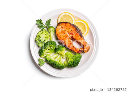 Roasted Salmon fish steak with steamed broccoli vegetables Roasted Salmon fish steak with steamed broccoli vegetables 124362785