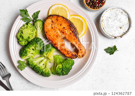 Grilled Salmon fish steak with broccoli. Fitness menu. Grilled Salmon fish steak with broccoli. Fitness menu. 124362787