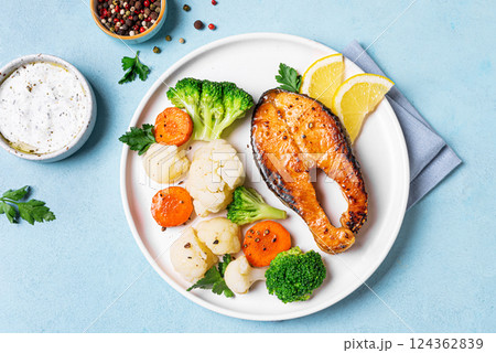 Roasted salmon fish steak with steamed vegetables 124362839