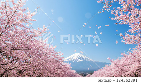 青空を背景に桜の花びらが舞い散る日本の春の風景 124362891