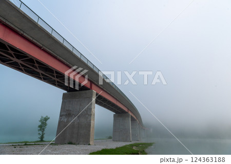 Bridge Sylvenstein on a foggy morning, side view from under the bridge 124363188