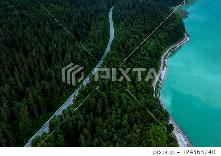 Aerial image with winding road in Bavarian Alps on Sylventein lakeshore, Germany 124363240