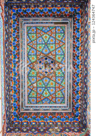 beautiful wooden painted carved ceiling in Museum of Art of Uzbekistan with Uzbek ornaments and colorful oriental patterns in Tashkent 124364747