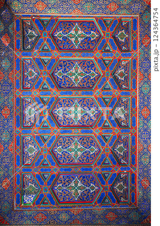 background of painted carved wooden celling with traditional Uzbek ornaments and oriental patterns in Tashkent in Uzbekistan background of painted carved wooden celling with traditional Uzbek ornaments and oriental patterns in Tashkent in Uzbekistan 124364754